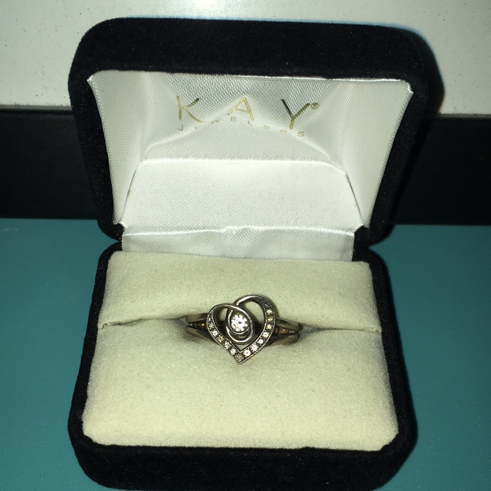 1/10 CT. T.W. Diamond Heart Twist Sterling Silver